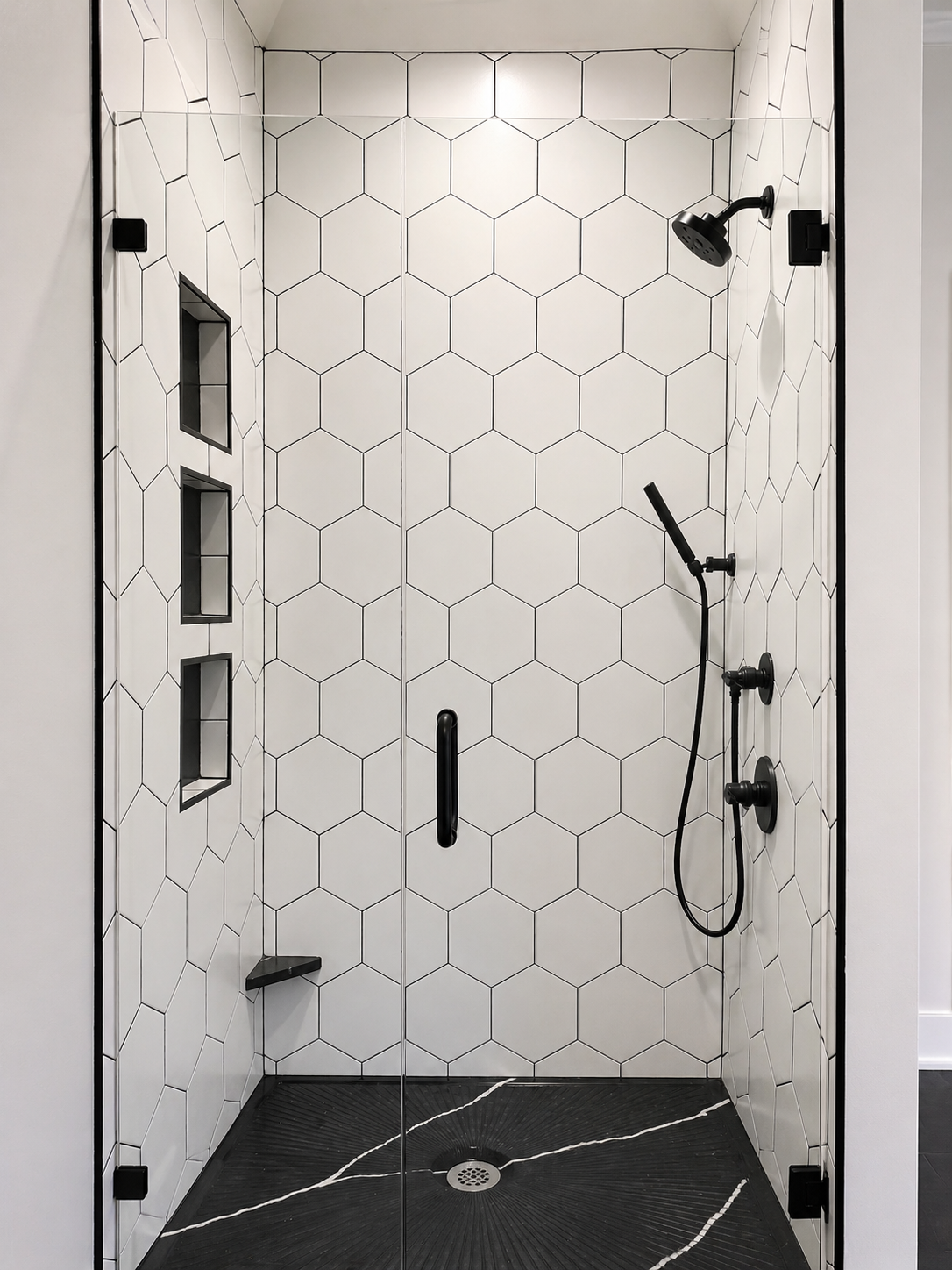 Panda White quartz shower pan with hex tile